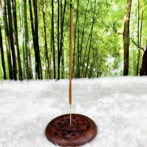 Incense stick in wooden holder